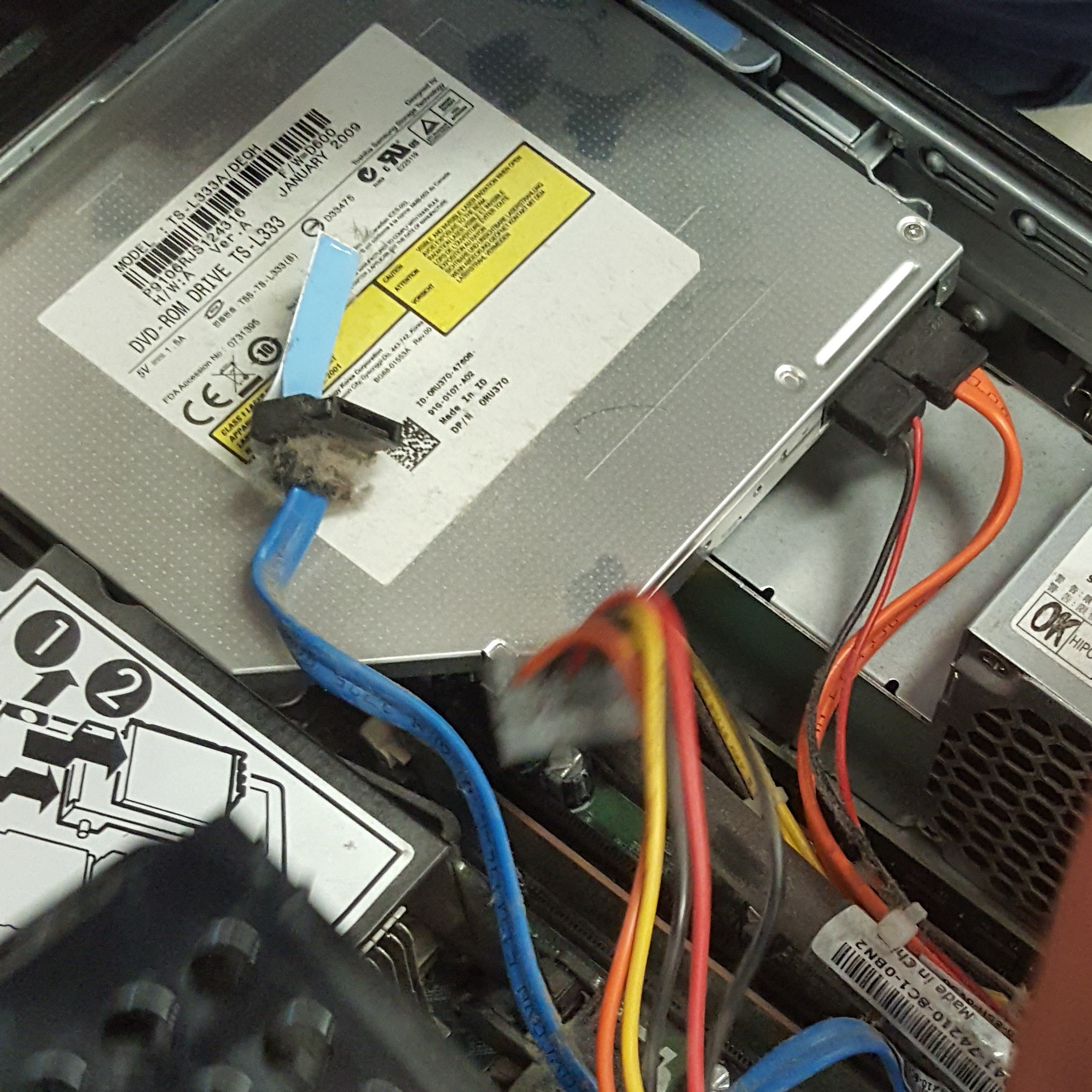 Image of the DVD drive from a Dell Optiplex 760 system unit.
